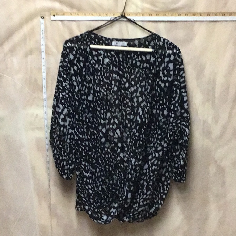 Jennifer Lopez open front woman’s blouse/shell.